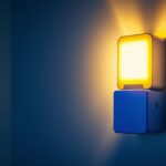 A photograph of a stylish emergency lamp with a battery prominently displayed in a well-lit installation setting