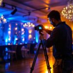 A photograph of a skilled lighting contractor expertly installing elegant uplighting at an event venue