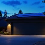 A photograph of a well-lit outdoor garage scene at dusk