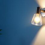 A photograph of a stylishly designed wall-mounted light fixture in a modern interior setting