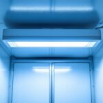 A photograph of a well-lit walk-in freezer showcasing a high-quality light fixture installed on the ceiling