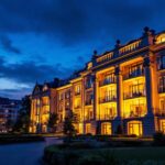A photograph of a beautifully illuminated building at dusk