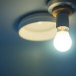 A photograph of a t12 light fixture with a t8 bulb installed