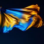 A photograph of a beautifully illuminated flag at night