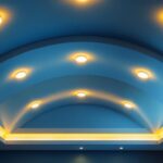 A photograph of a beautifully designed vaulted ceiling featuring recessed lights in a stylish interior