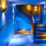 A photograph of a well-lit basement stairway that highlights various lighting options