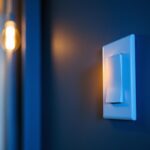 A photograph of a single pole switch being installed or used in a residential lighting setup