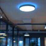 A photograph of a modern lighting installation in an office or commercial space