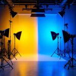 A photograph of a well-lit studio setup showcasing various types of professional lighting equipment in use