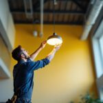 A photograph of a lighting contractor efficiently installing a sleek